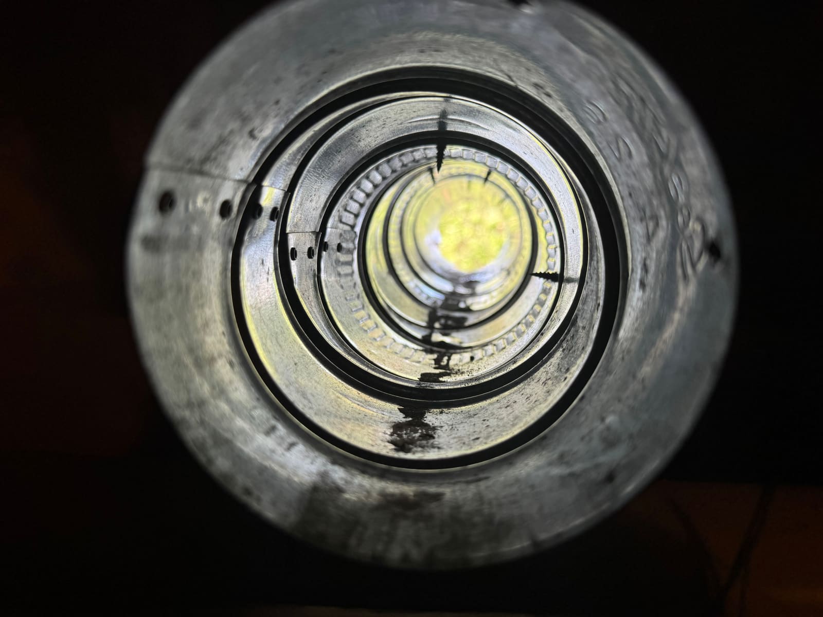 The same vertical dryer duct after cleaning, with daylight visible clearly straight through the run.